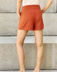 And The Why Every Little Thing Full Size Pleated High Waisted Shorts in Ochre